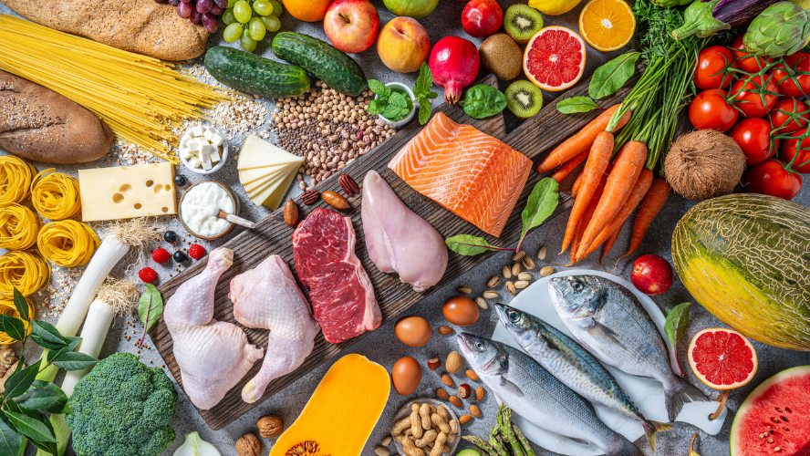 A selection of healthy foods including including meats, grains, vegetables and fruits